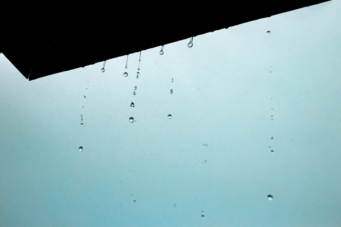 Close-up view of water droplets from the ceiling
